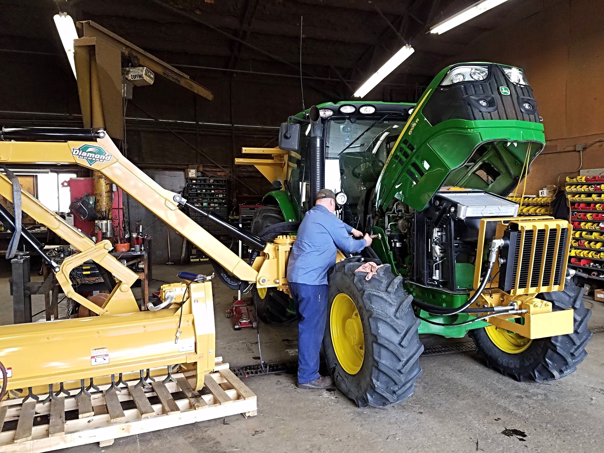 Man Maintenance A Tractor