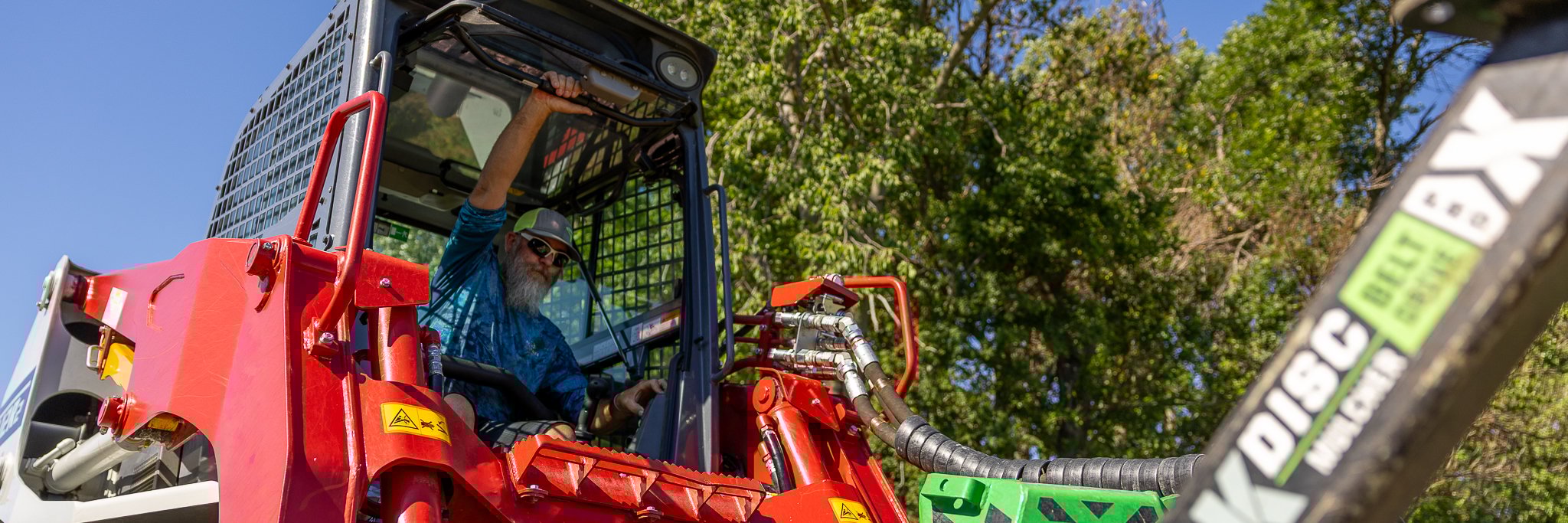 person entering a skid steer