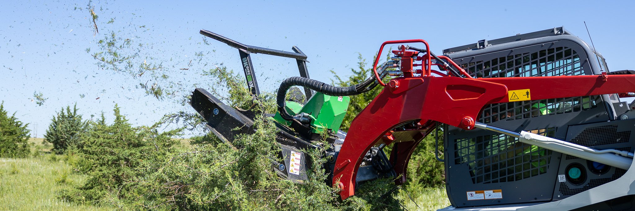 skid steer disc mulcher belt drive pro x cutting a tree